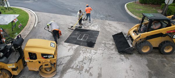 Commercial paving contractor in Coral Springs, 3-D Paving and Sealcoating works on a parking lot drainage issue in a parking lot
