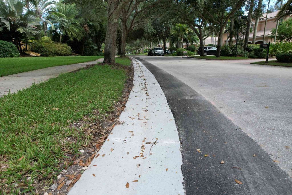 Concrete Contractor 3-D Paving installed new concrete gutters on a residential street in Tamarac, FL. Experts in concrete gutters, curbs and more.