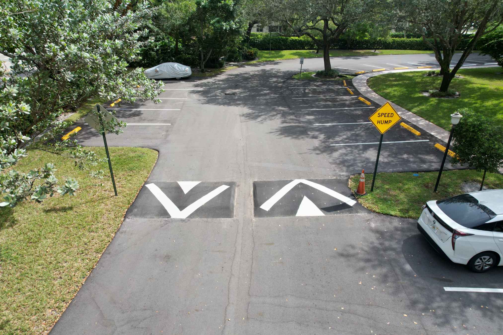 Commercial paving contractor, 3-D Paving and Sealcoating in Coral Springs installs double wide custom asphalt speed bumps at an apartment complex in Fort Myers, FL.