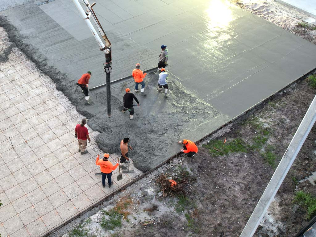 Concrete slab being poured for a concrete parking lot and constrction project in Pompano Beach, Florida.