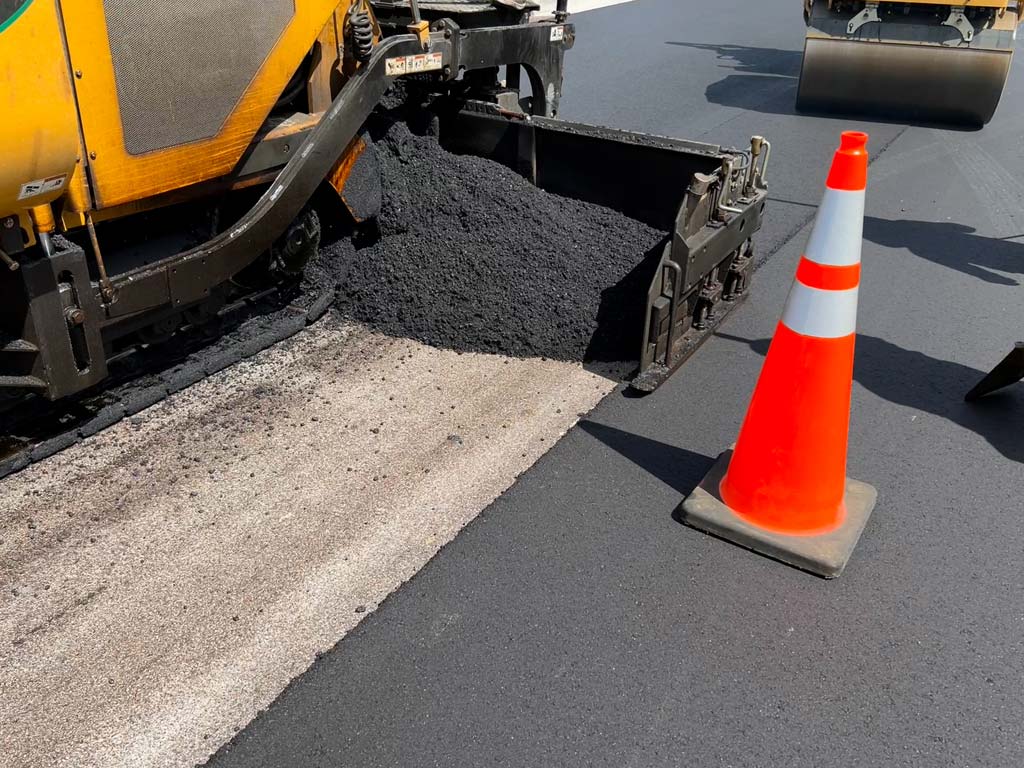 Installing Asphalt Paving a roadway in Fort Lauderdale Florida in August of 2022 onto a road that really needed asphalt repairs.