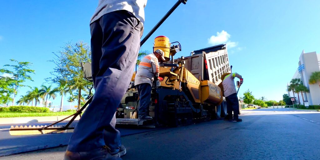 Paving crew laying down fresh asphalt at the new Pompano Crossings Industrial Park in Pompano Beach, FL in November of 2022. Searching for the best blacktop company? Look no further then 3-D Paving.