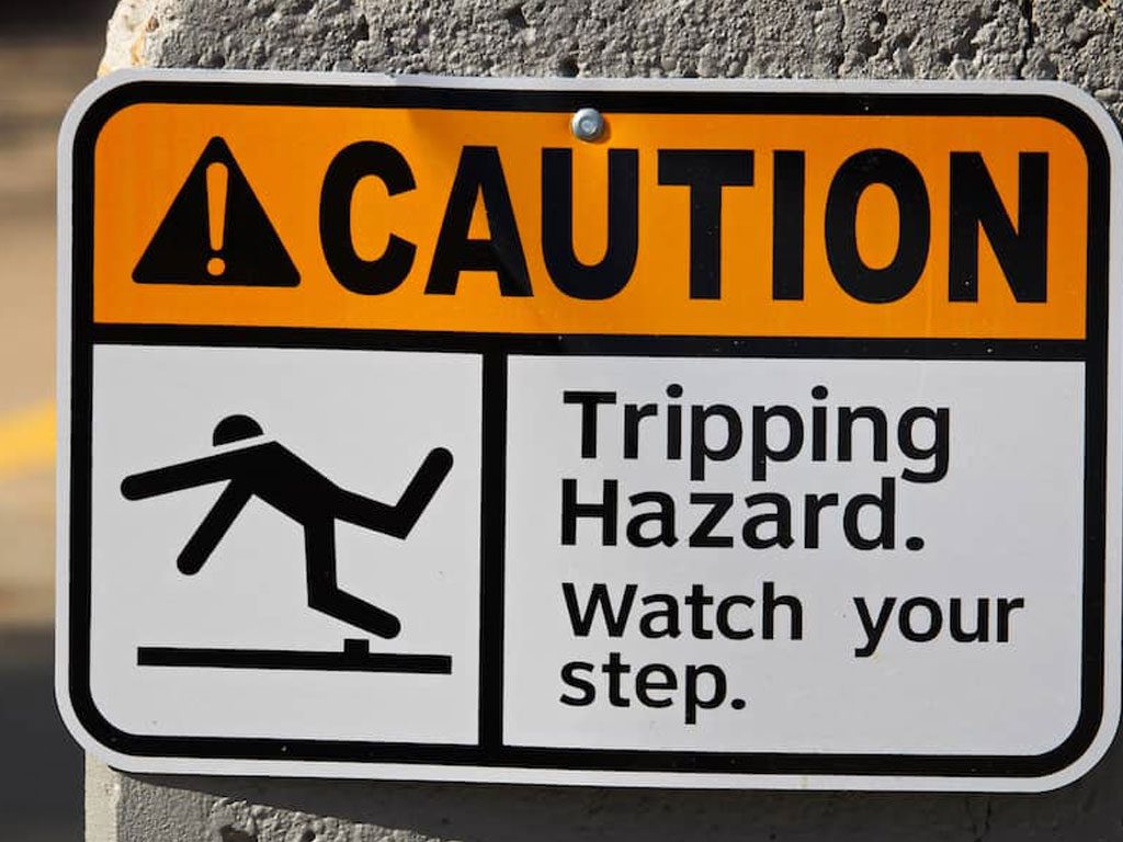 Caution, Trip hazard, watch your step parking lot sign used to mark a raised or uneven area of pavement that may cause someone to stumble or get hurt while on a commercial property. Need parking lot or roadway signage? Call the parking lot experts at 3-D Paving and Sealcoating to help with all of your asphalt and concrete concerns. 3-D Paving is based on Coral Springs, FL and serves all of South Florida.