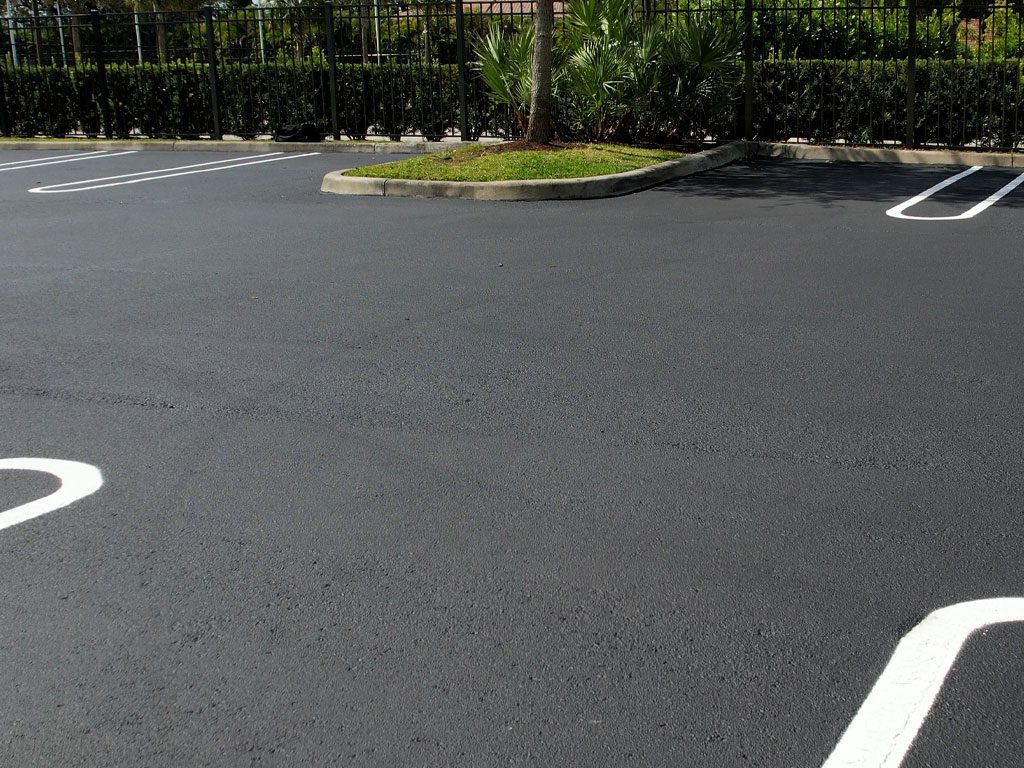 Freshly paved, sealed asphalt & striped parking lot in Coral Springs, FL by 3-D Paving and Sealcoating. South Florida's Commercial Paving Experts. April 2023. Prevent unsightly oil stains or grease stains in your asphalt surfaces by protecting them with Sealcoating. 