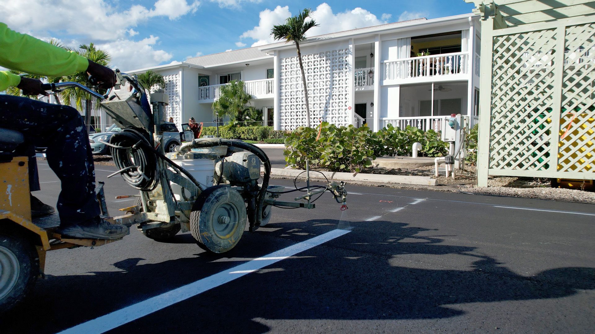 Parking lot line striping or asphalt striping machine putting down vinyl striping parking lines on a newly renovated parking lot in West Palm Beach and Boca Raton Florida in May of 2023. Looking for Sealcoating in Pompano Beach? Call the experts at 3-D Paving today! 1-855-735-ROAD Looking for Sealcoating in Delray Beach? Call the Delray asphalt experts at 3-D Paving today! Striping in Naples, FL.