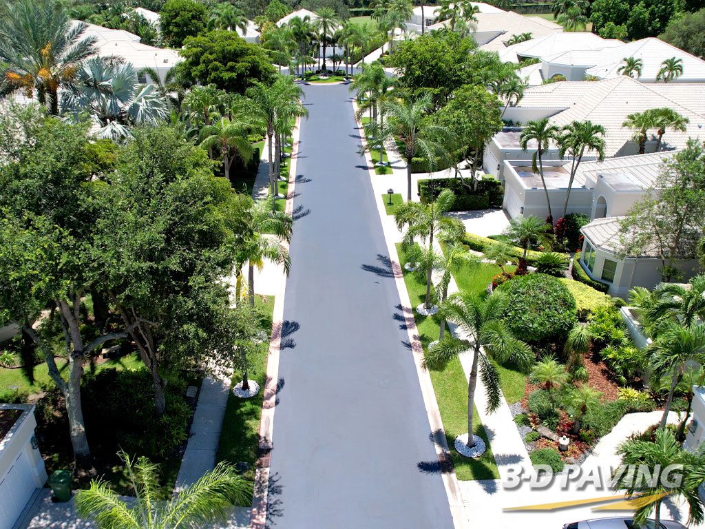 Aerial view of an ongoing sealcoating project by 3-D Paving and Sealcoating in a high-end residential community in Weston, Florida, captured using a DJI Air2S drone.