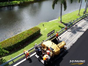 Aerial shot of an asphalt paving crew in South Florida. 3-D Paving and Sealcoating serves all of South Florida pictured here doing asphalt paving in Boynton Beach. Paving in Fort Myers Florida.